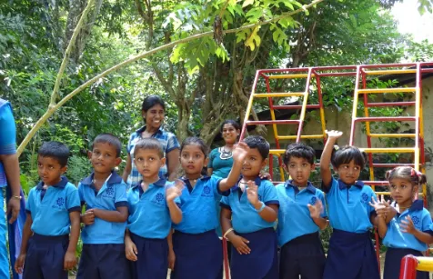 Children in their colorful blue uniforms.