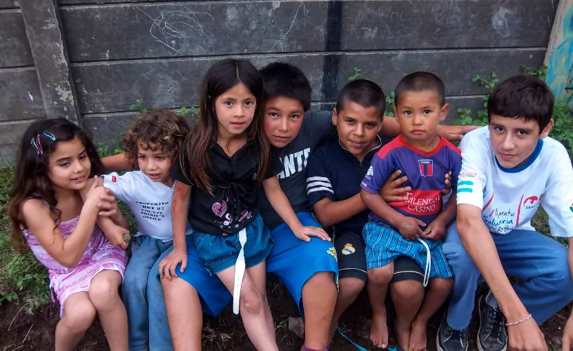 A group of Argentinian children sit and pose for the camera.