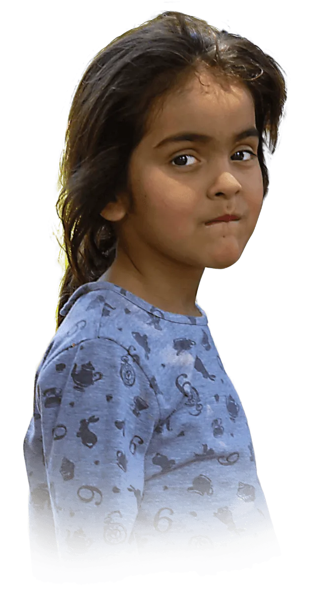 A young girl looking over her right shoulder with needy-eyes.