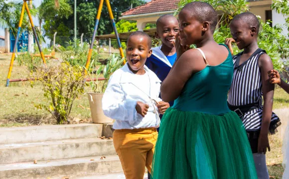 Laughter before a dance at the Kibaha children's home.