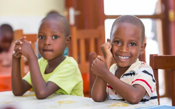 Two Tanzanian boys in a classroom.