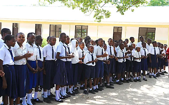 Teenager Tanzanian school children assembled in the  school yard.