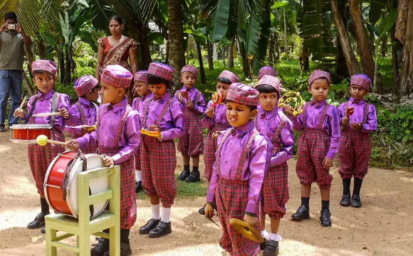 A kindergarten marching band preparing to start their music.