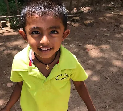A cute Sri Lankan boy says "hello".