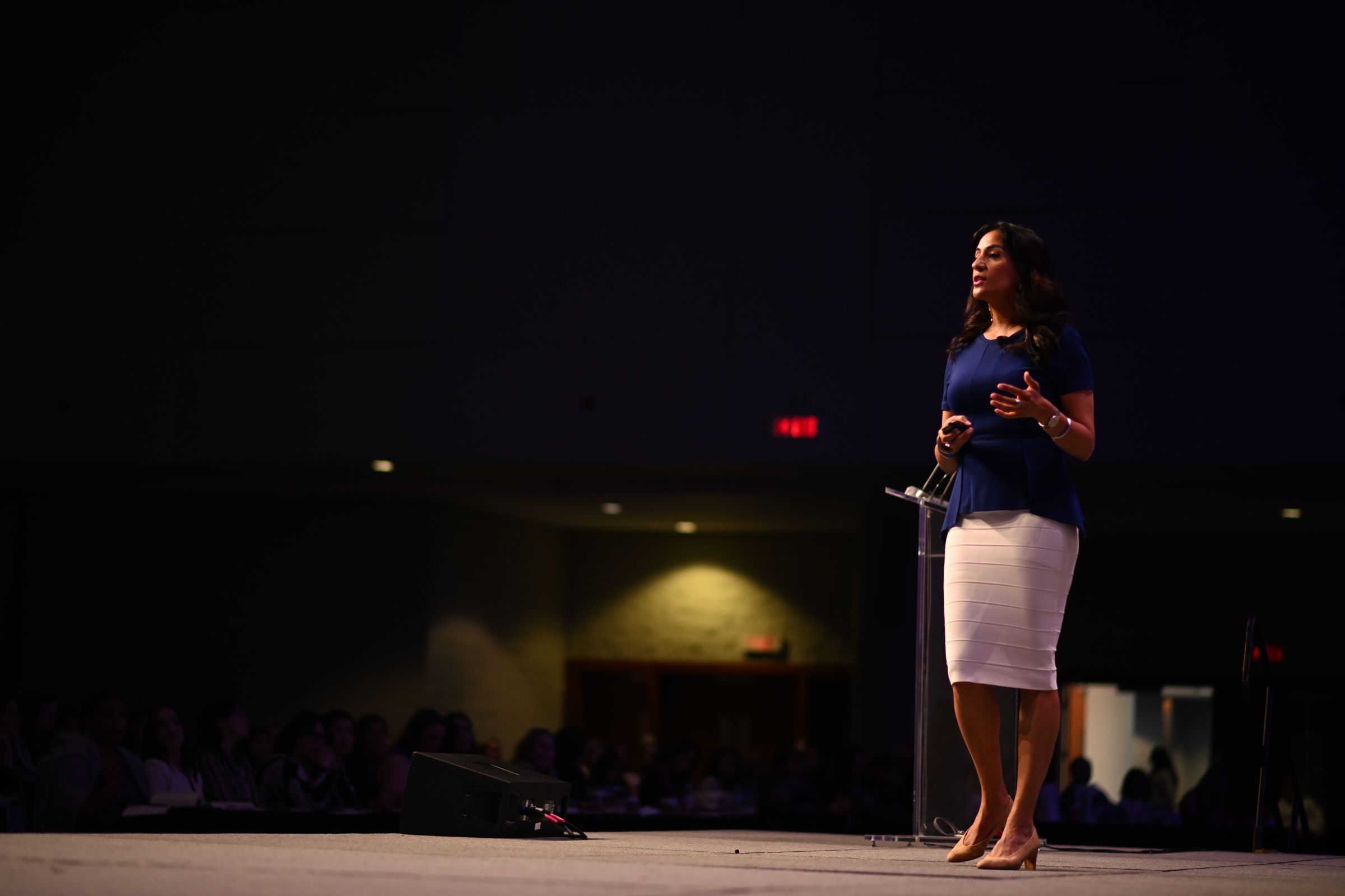 Dr. Shimi Kang delivering a keynote on stage
