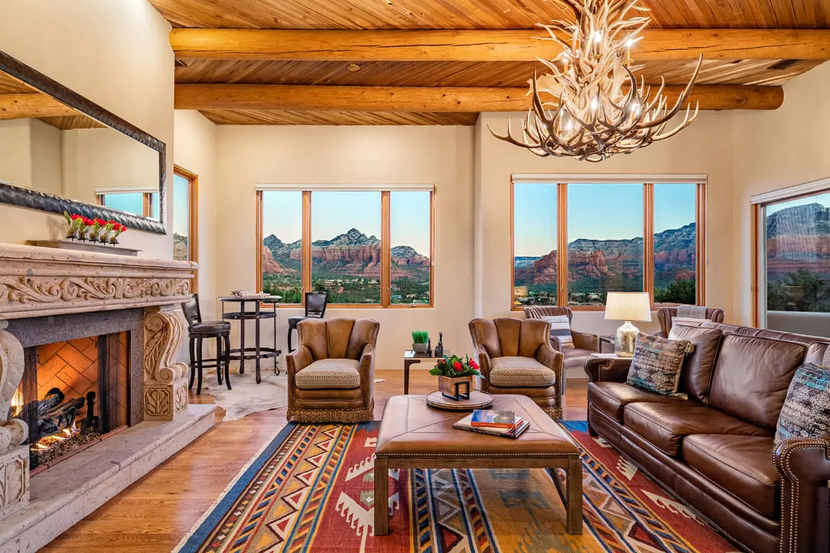 Desert Modernist home in Sedona featuring flat roofs, broad overhanging eaves, expansive glass windows, and native desert landscaping.