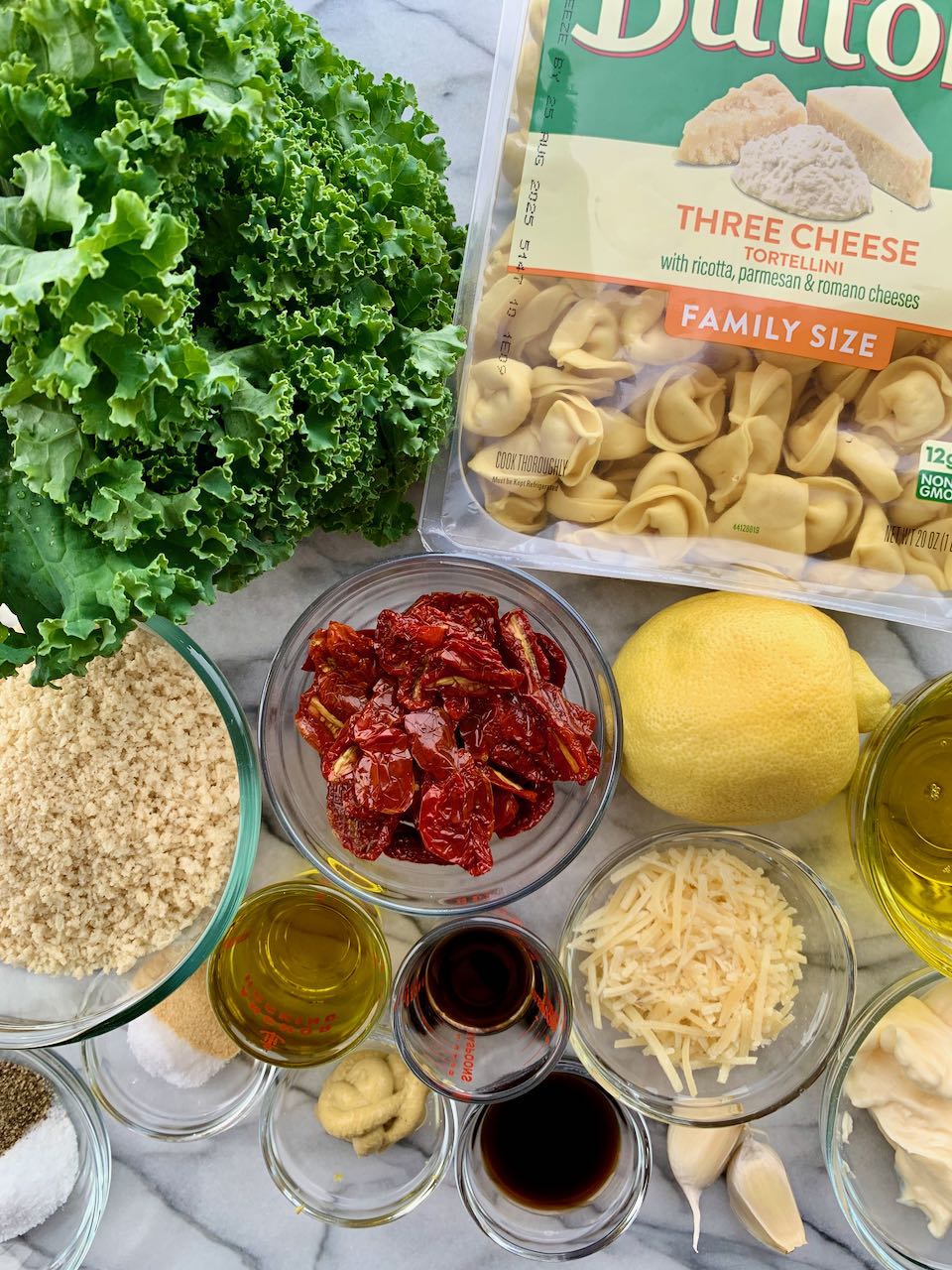 Ingredients assembled for Kale Caesar Tortellini Salad