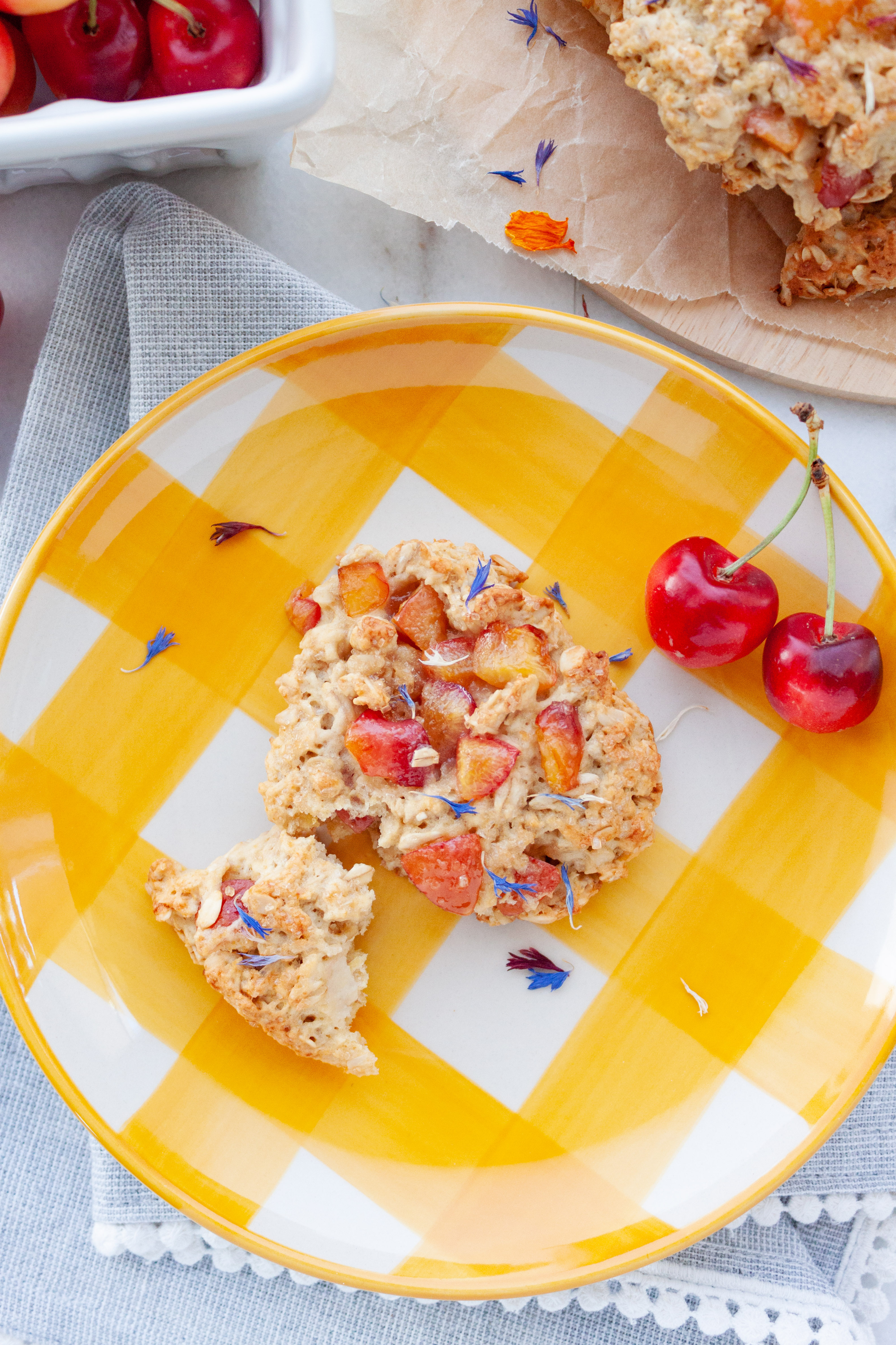 Cherry Lemon Oat Scone on a yellow gingham plate