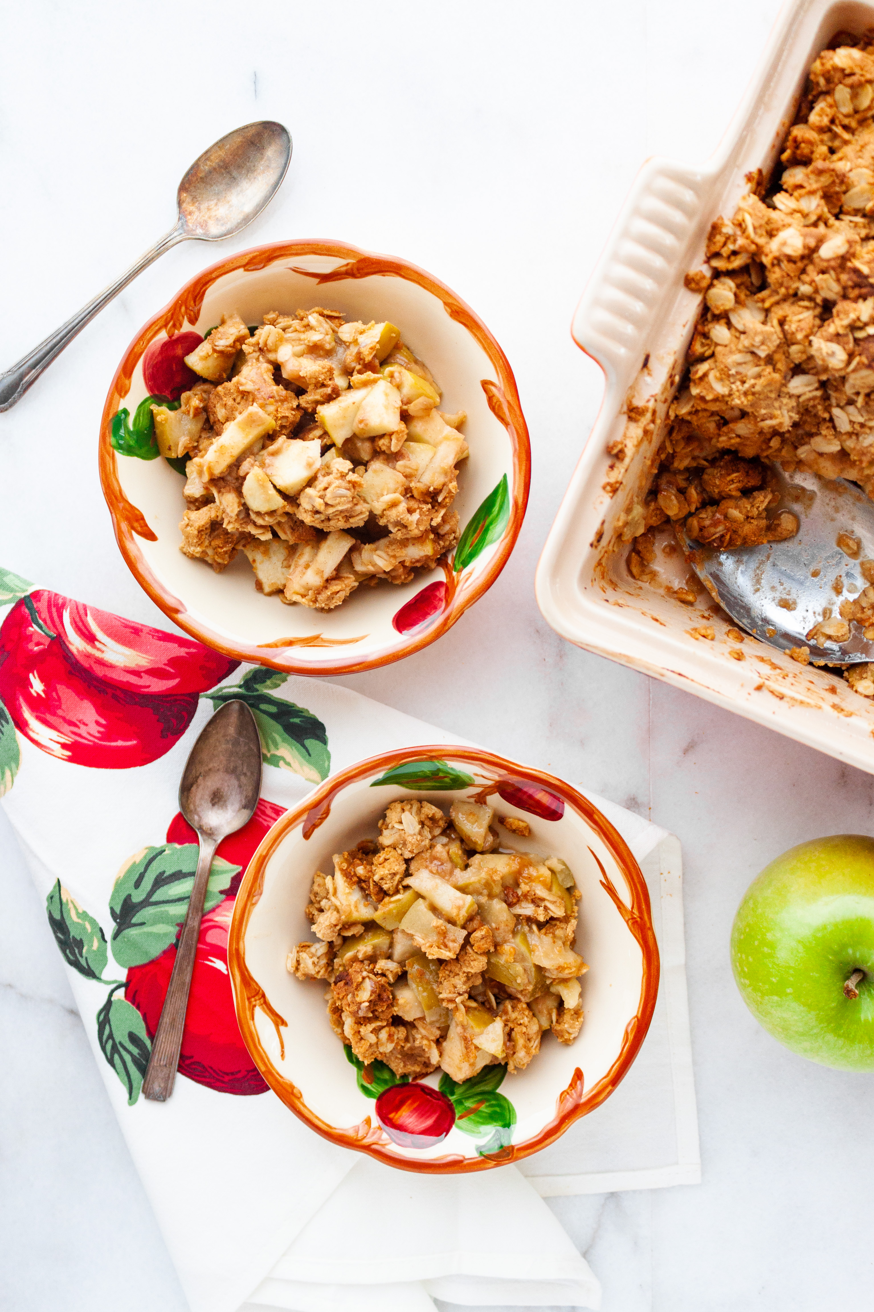Peanut Butter Apple Crisp served in vintage apple dishes