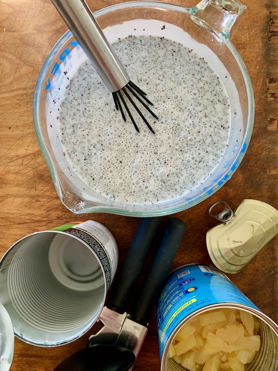 Pudding ingredients whisked together in a bowl