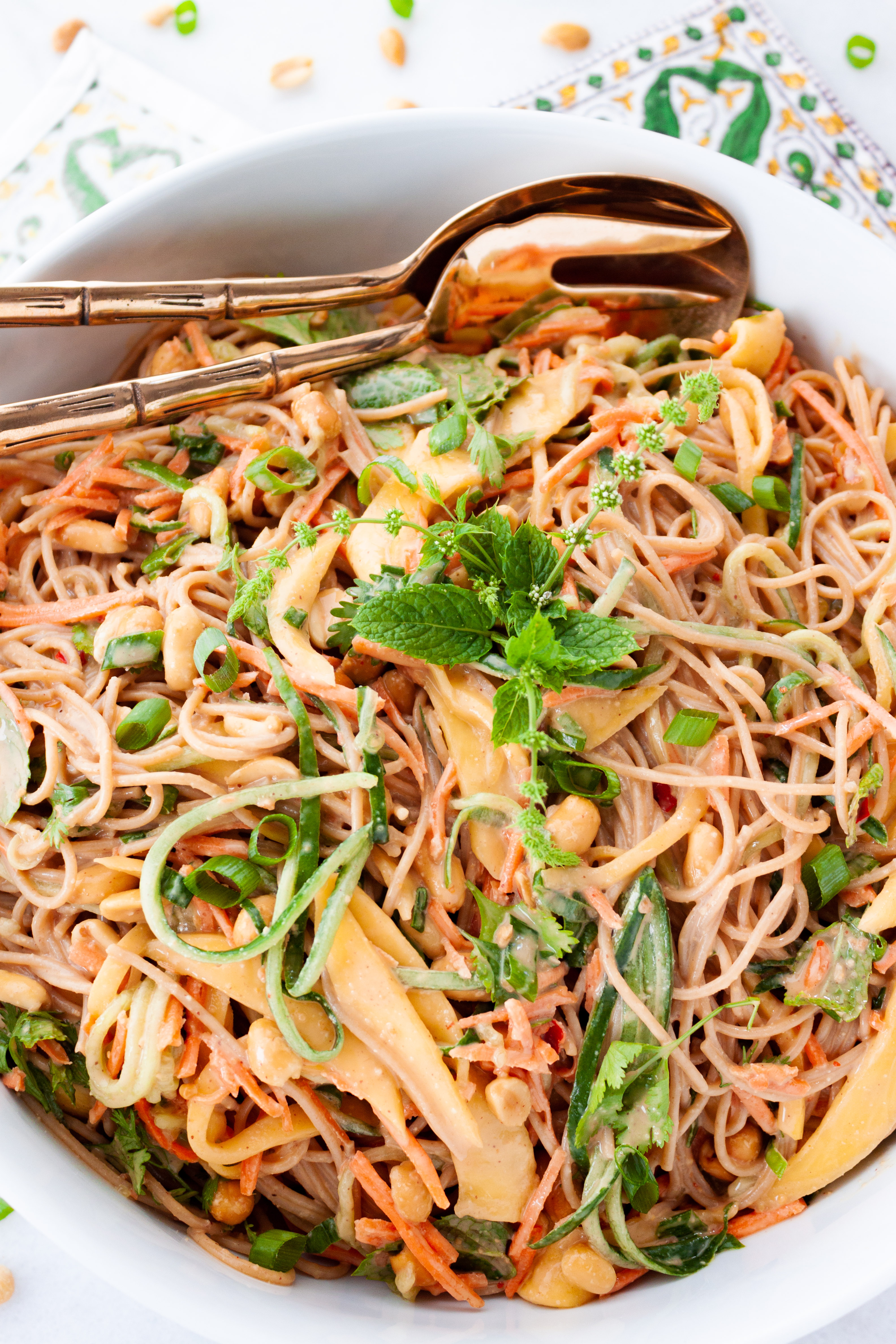 Mango Peanut Noodle Salad in a large white serving bowl