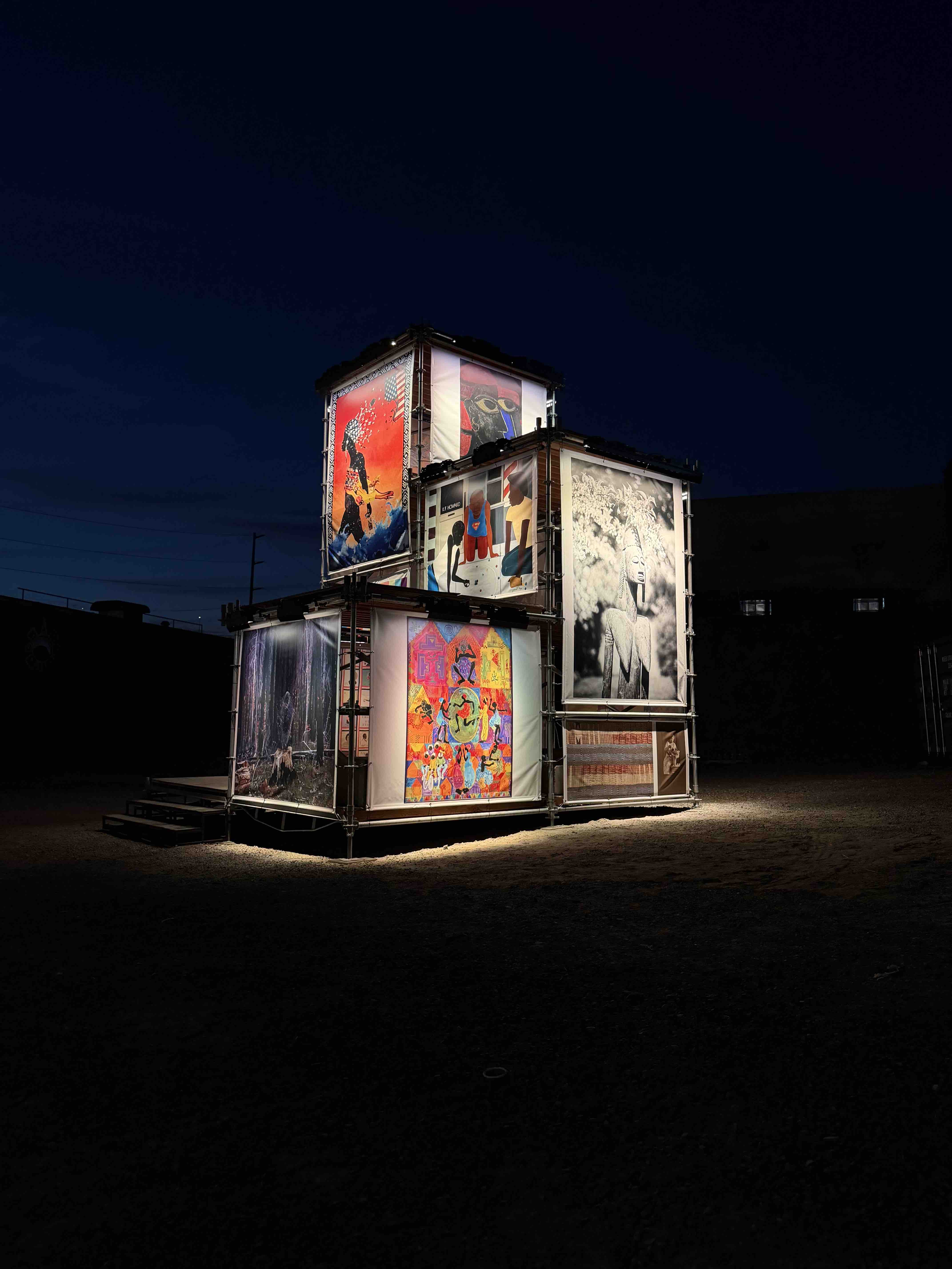 The 1803 Fund sculpture lit up in the park at dusk