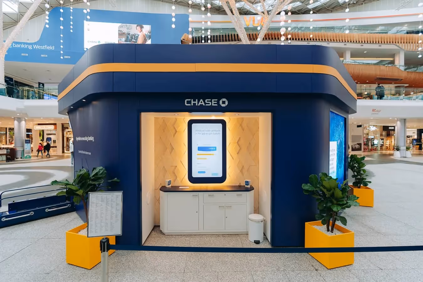 At the back of the Chase Octagon, an oversized screen in the shape of a mobile phone displays a set of questions to be answered after the interactivity session.