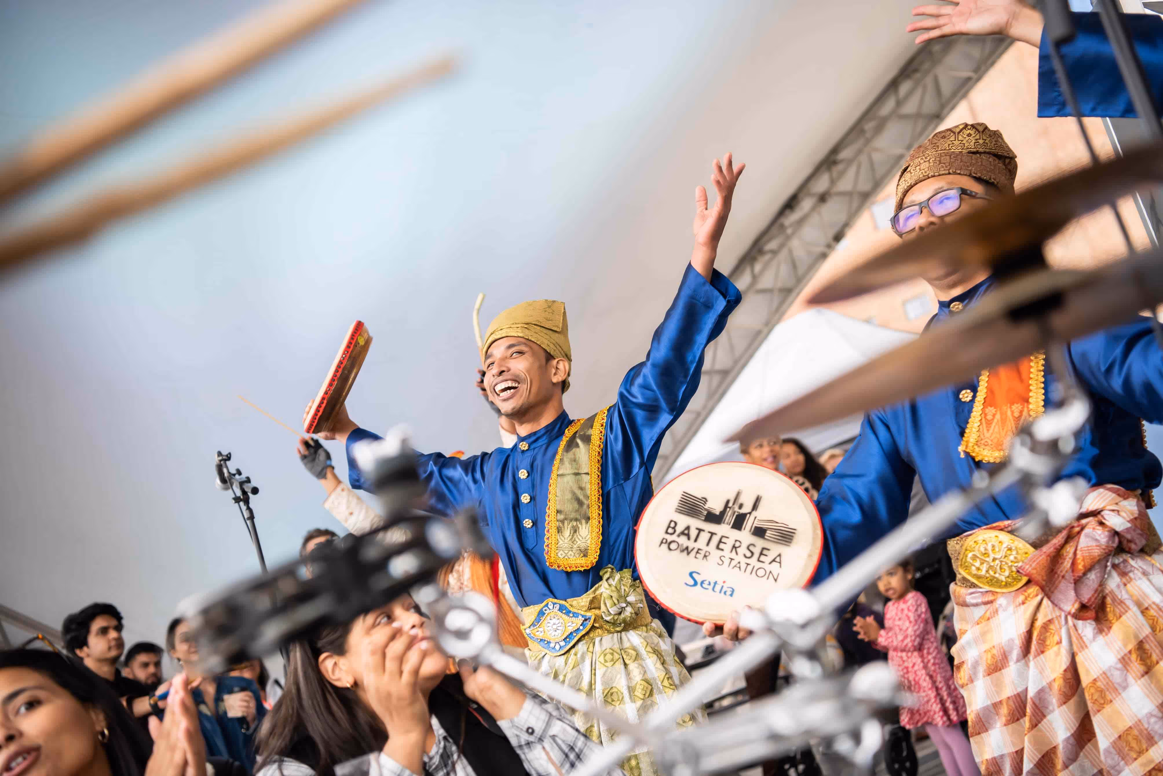 Malaysian dancers perform in traditional dress at Battersea Power Station launch event.