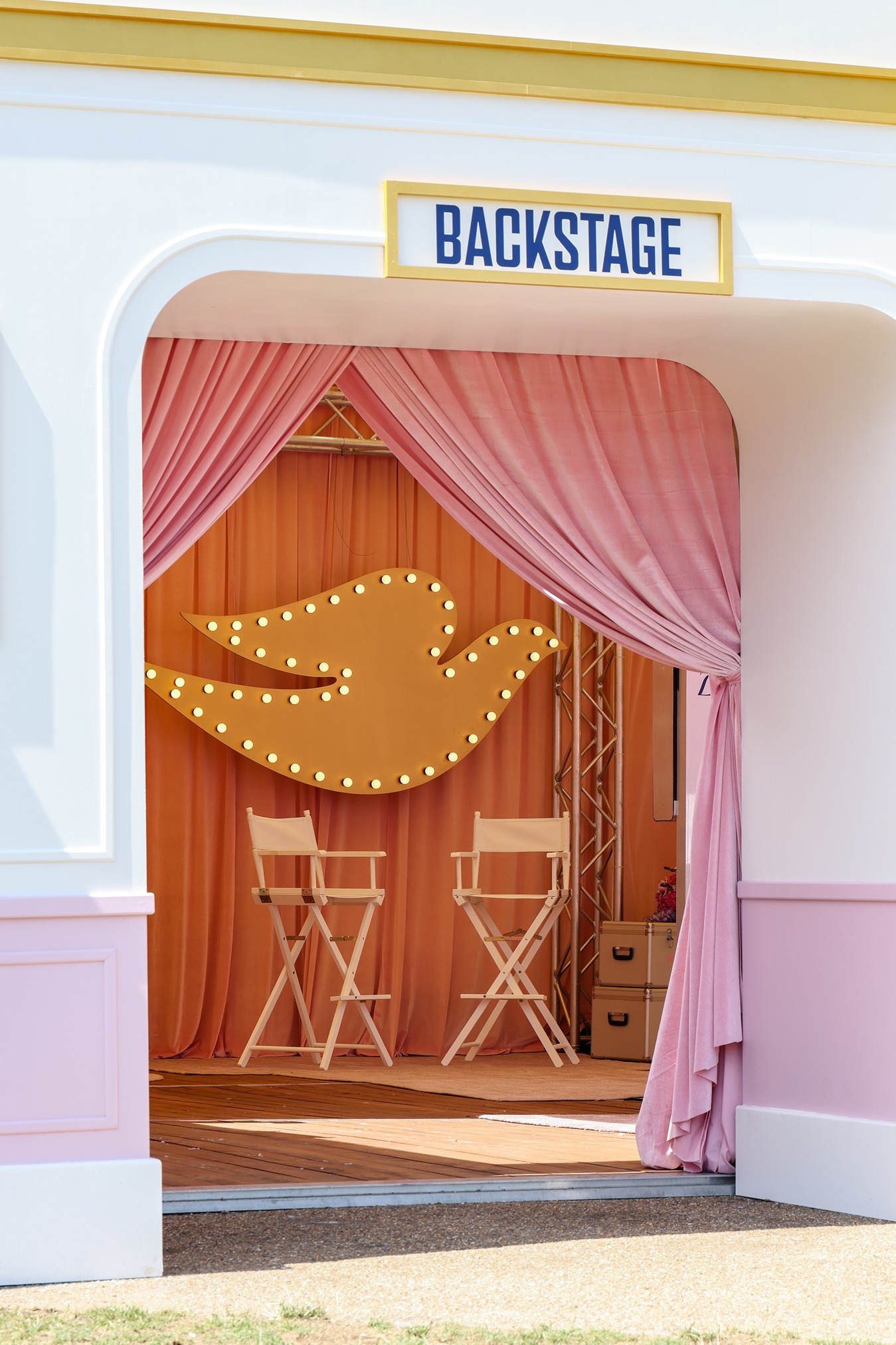 View through activation door to see a large Dove logo at 'Backstage with Dove' beauty pop-up by Bearded Kitten