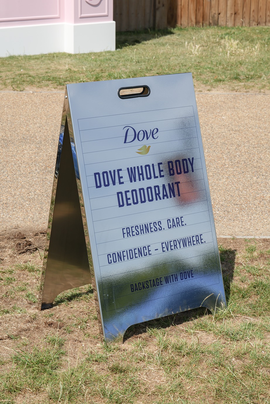 Old cinema-style A board outside at 'Backstage with Dove' beauty activation by Bearded Kitten