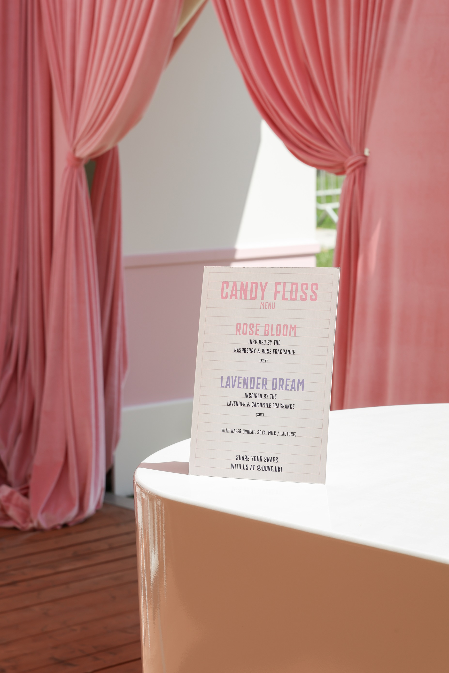 Candy floss menu perched on the end of the bar at 'Backstage with Dove' beauty pop-up by Bearded Kitten