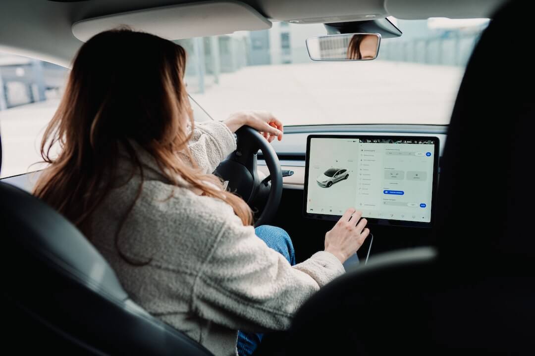 A woman used the Tesla Model 3’s touchscreen