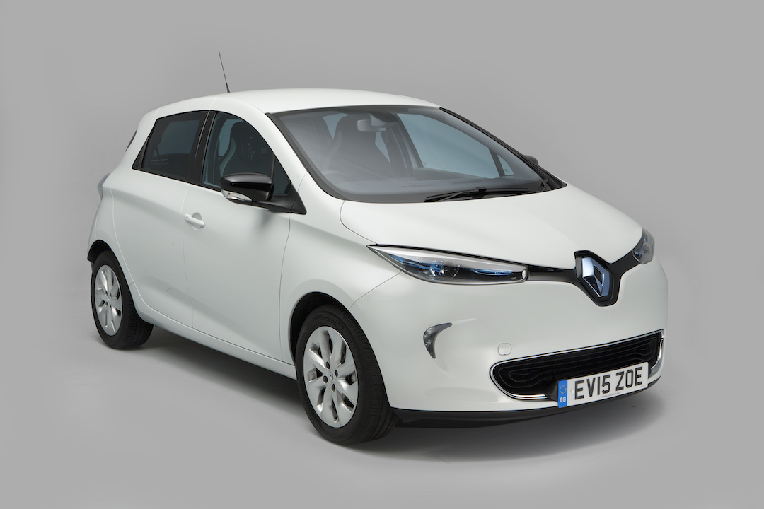 A white Renault Zoe parked diagonally on a grey background