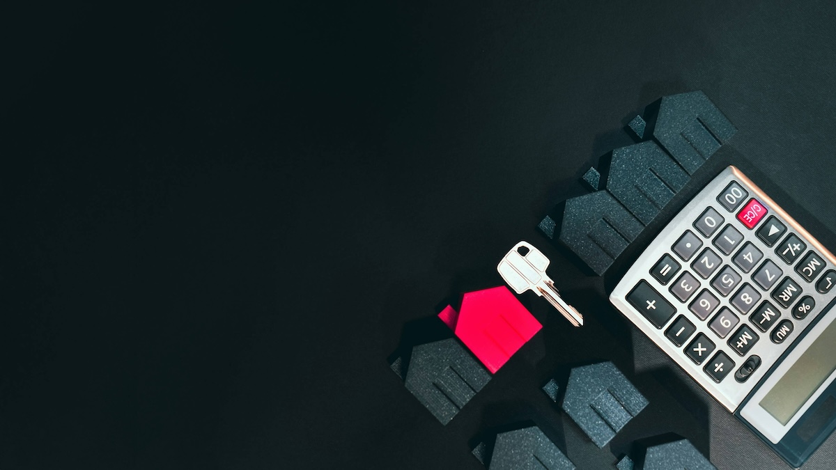 A calculator on a dark background with 