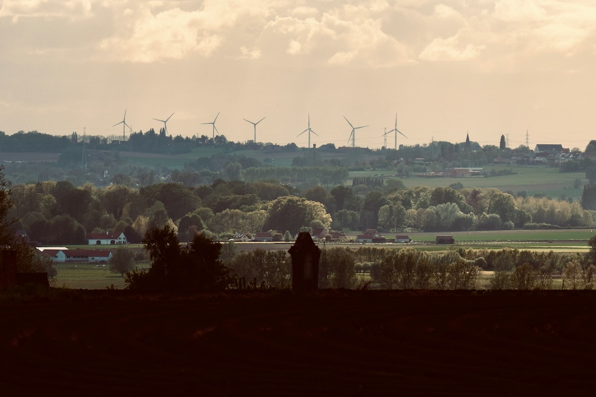A skyline with wind turbines on the horizon