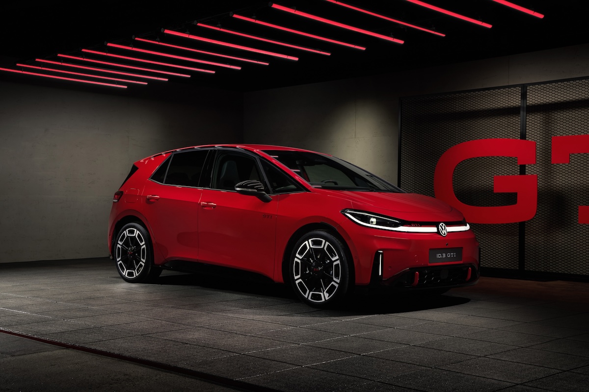 Red Volkswagen ID.3 GTI in a studio with GTI lettering behind it