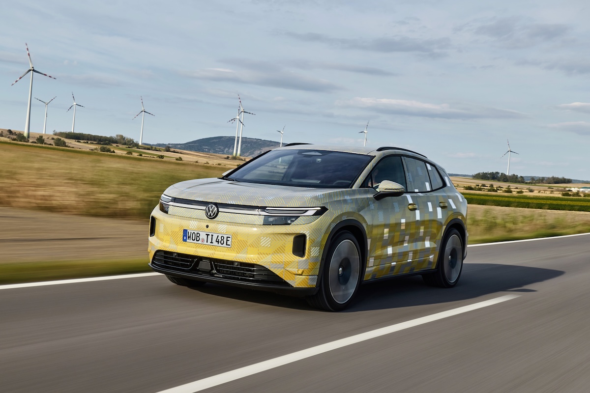The new VW ID. Tiguan drives along a smooth road