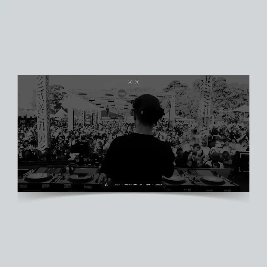 Website homepage with a video banner of a DJ wearing headphones performing to a large outdoor crowd under a covered stage in daytime.