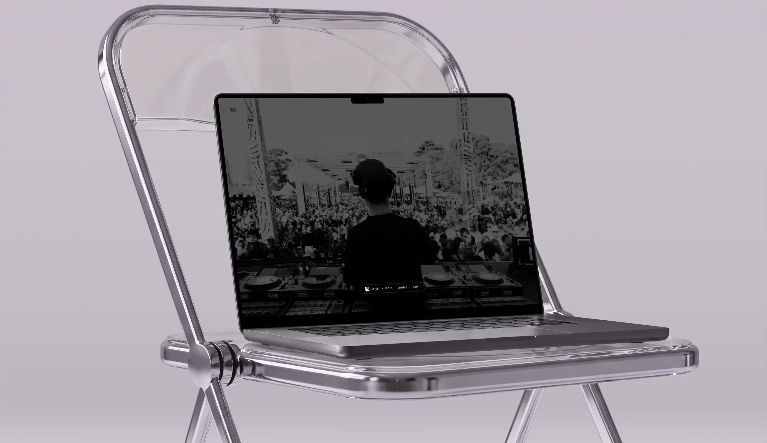 A sleek laptop displaying a black-and-white image of a DJ performing in front of a large crowd, placed on a transparent folding chair with a gray background.