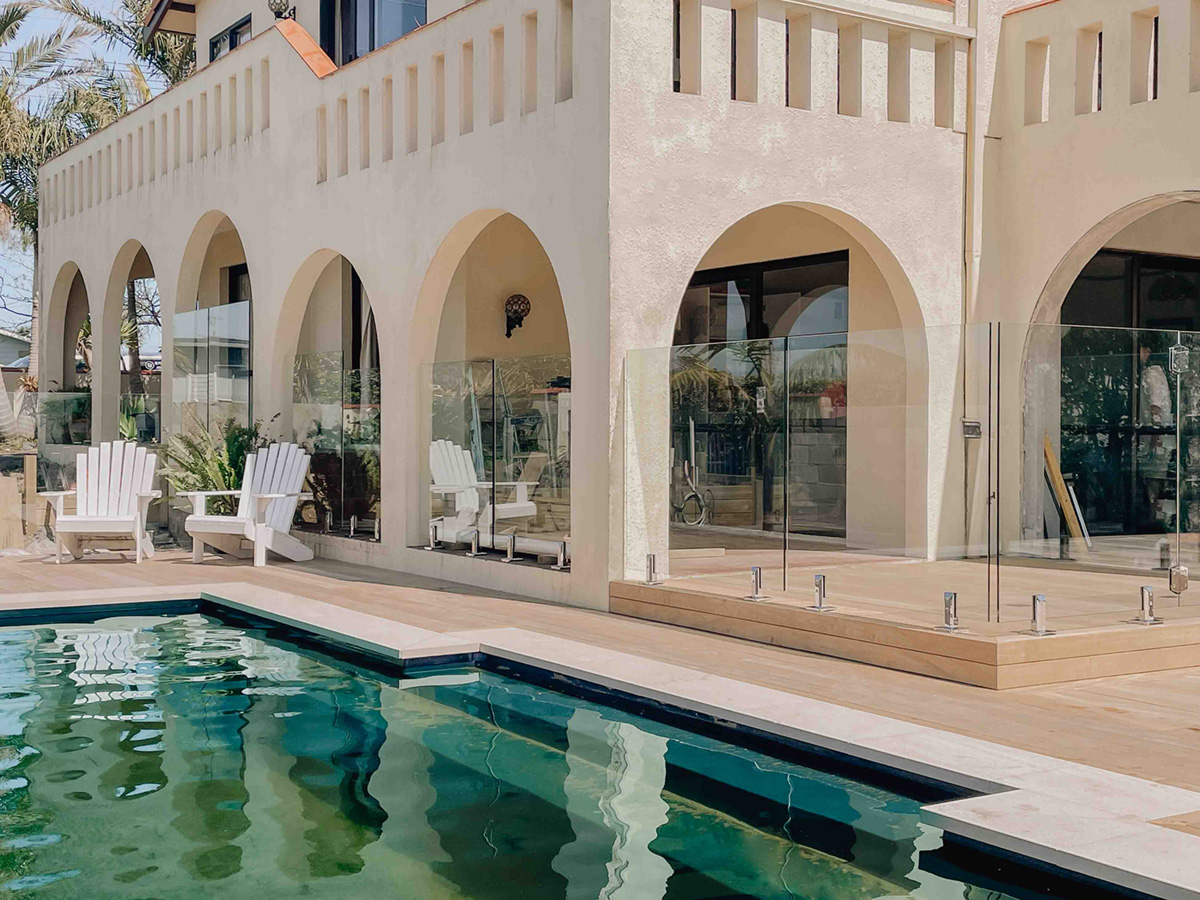 Frameless glass pool fence at a large house