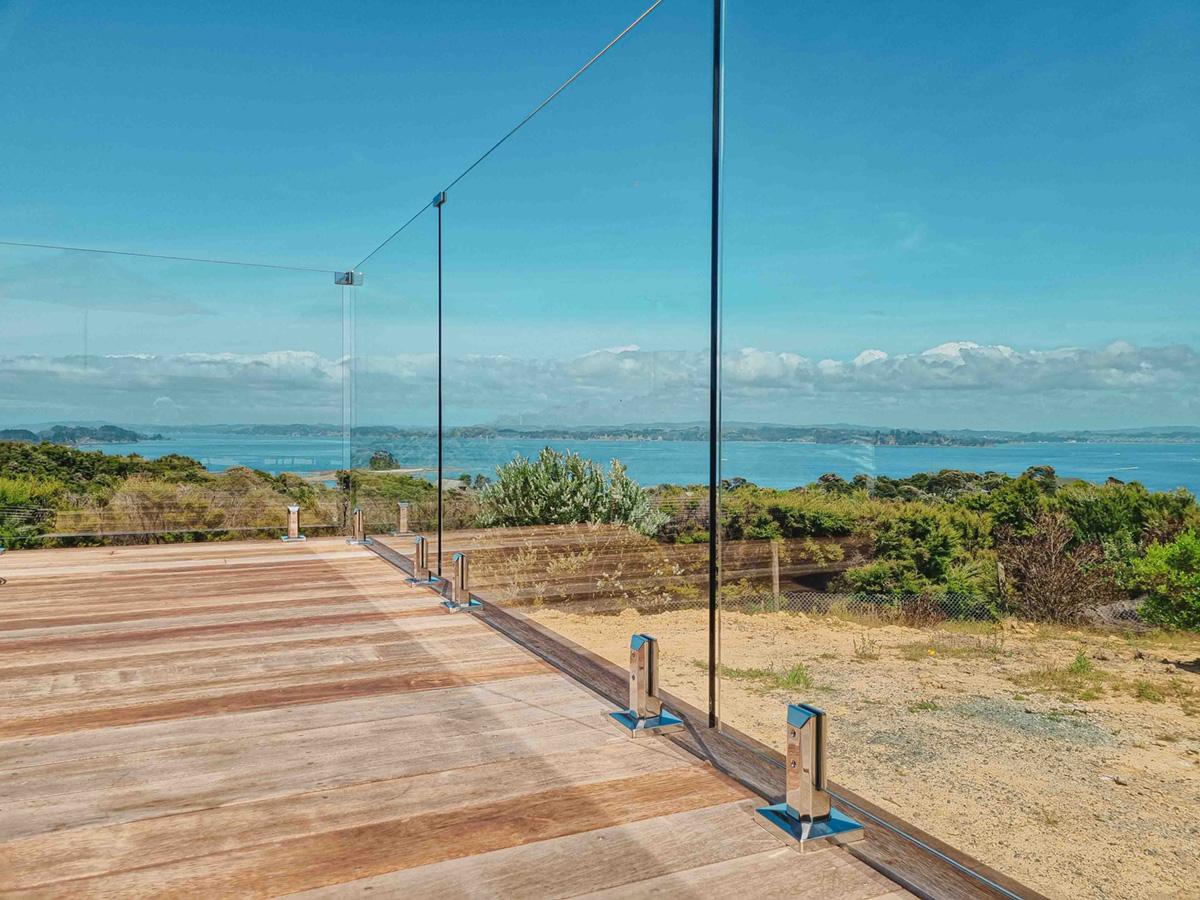 Frameless glass balustrade on a deck overlooking the sea
