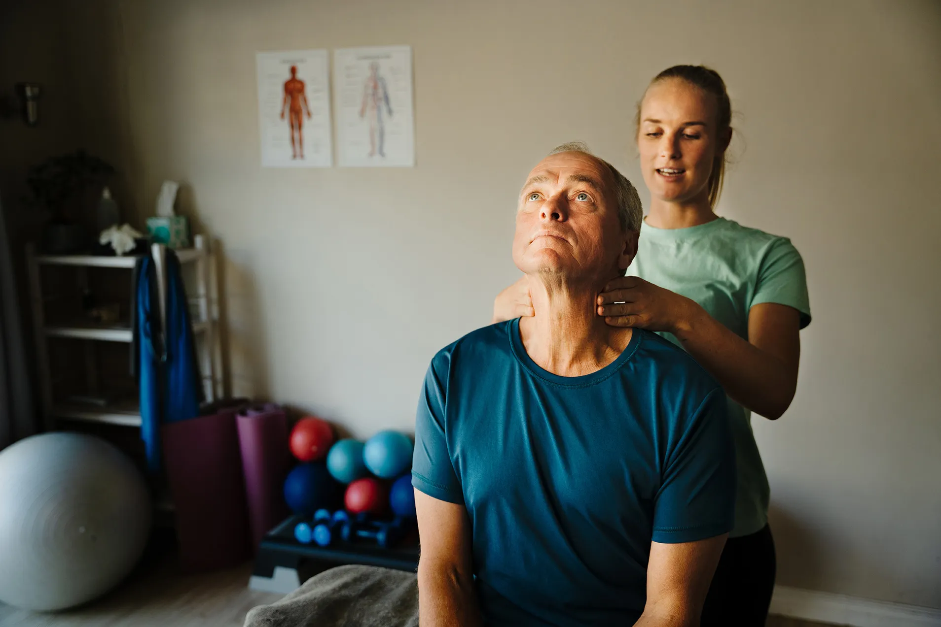Physical therapist working with patient