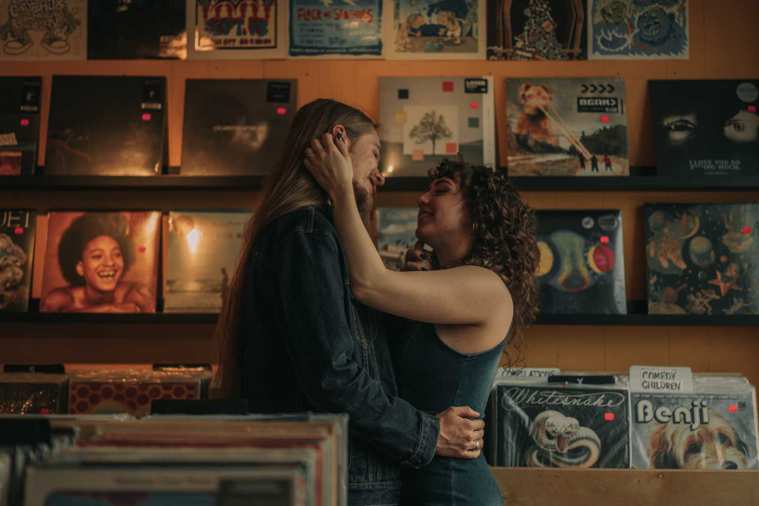 a couple in a vintage record store in Downtown, Calgary Engagement session
