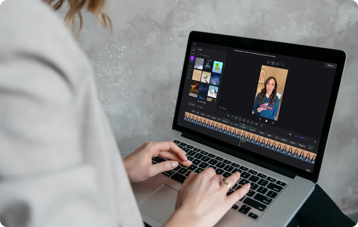 Person using Captions’ video editor with media added to it.