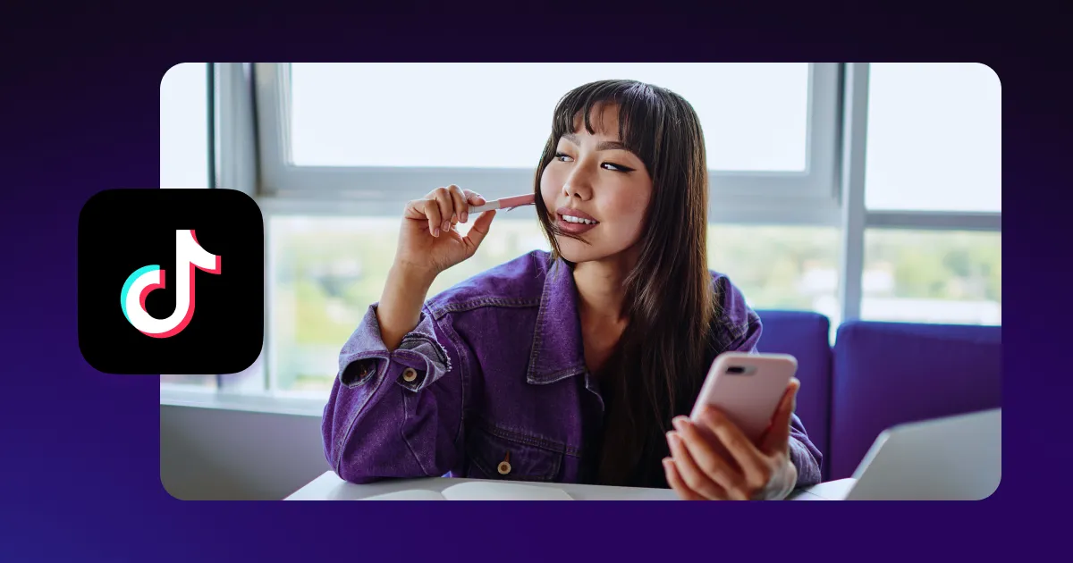 A person looking at their phone with a TikTok logo on their side.