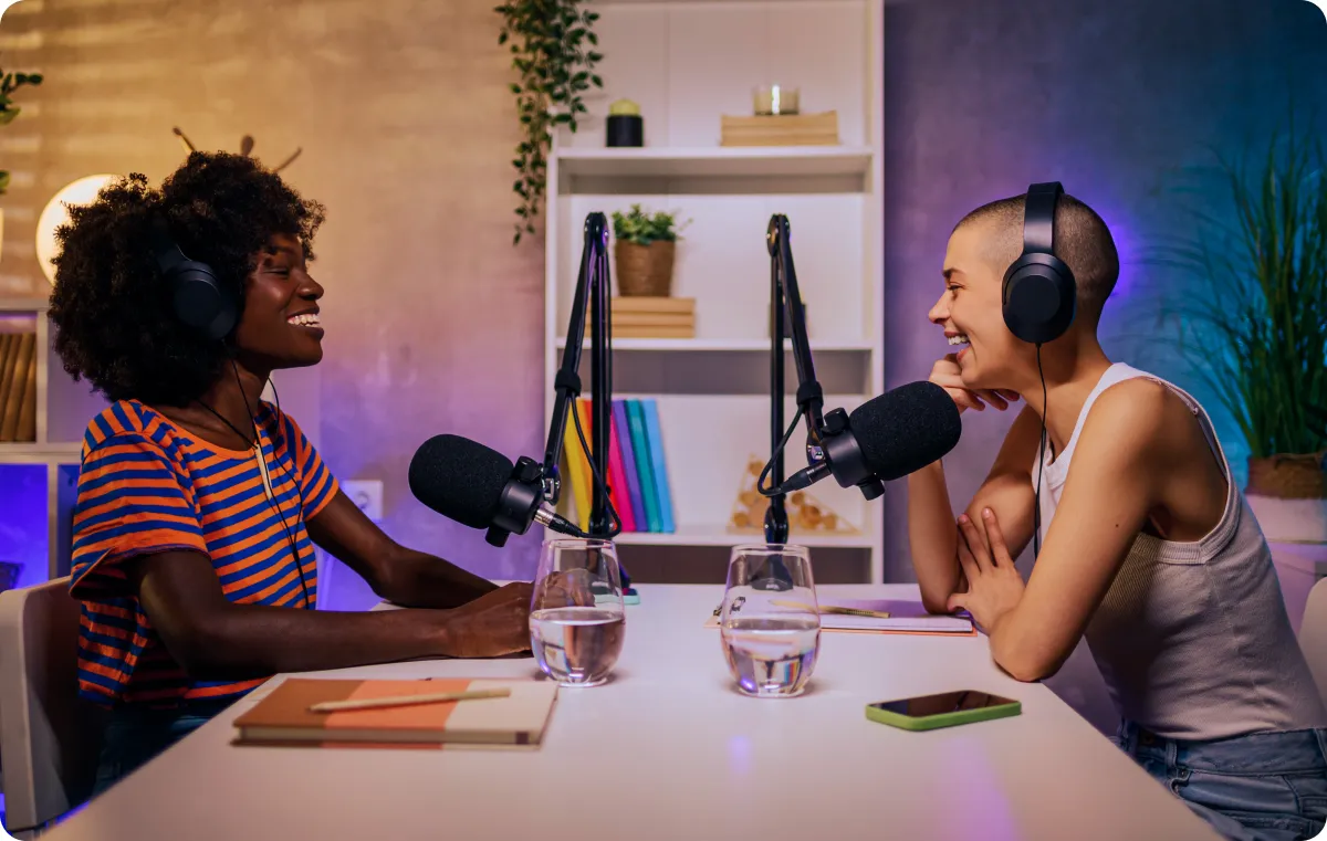 Two podcasters recording. 