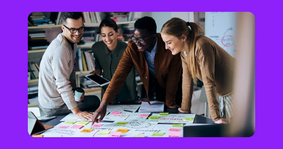 Content creators developing a content strategy, with planning and related icons surrounding them.