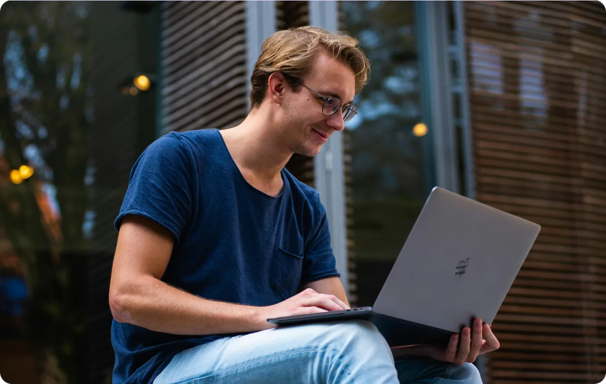 A creator writing on a computer.