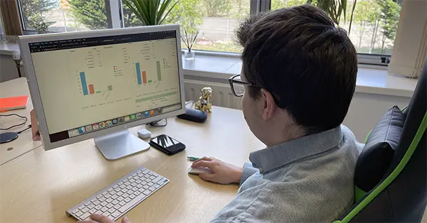 survey data and results analysis someone working at computer