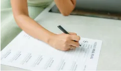 hand writing out a meal plan
