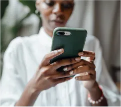 woman checks through phone 