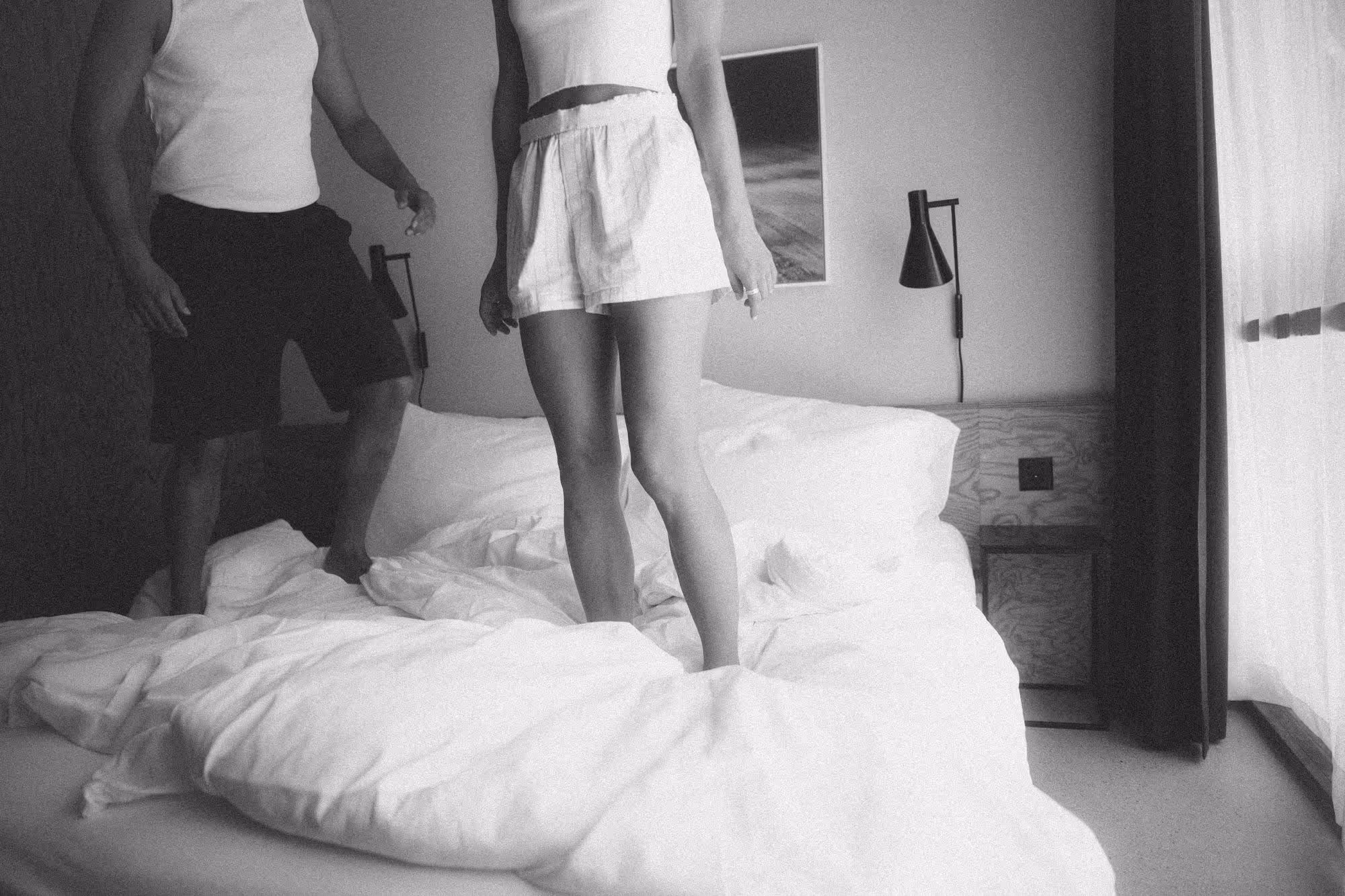 a woman standing on a bed