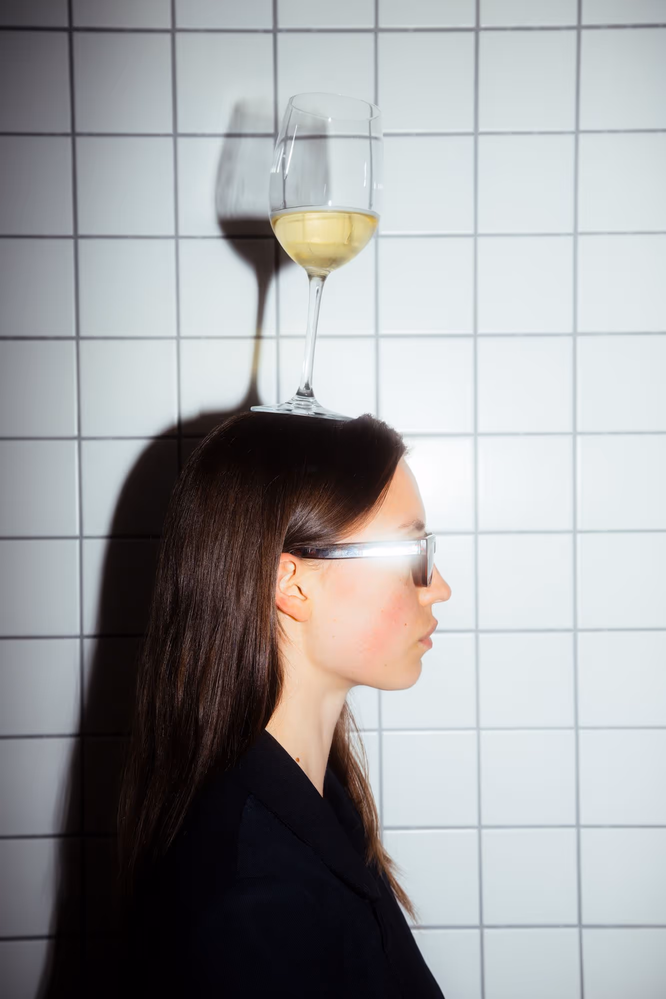 a woman with a glass on her head