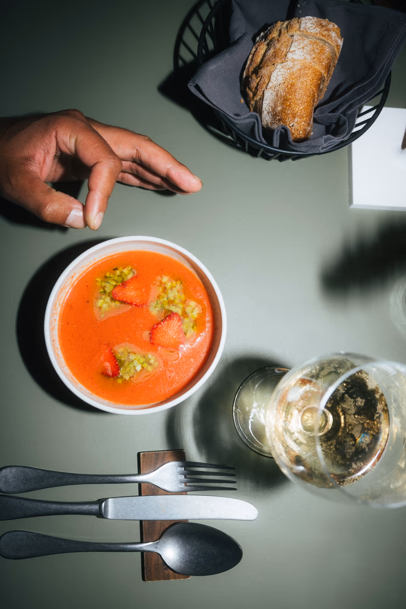 a bowl of soup and a glass of wine