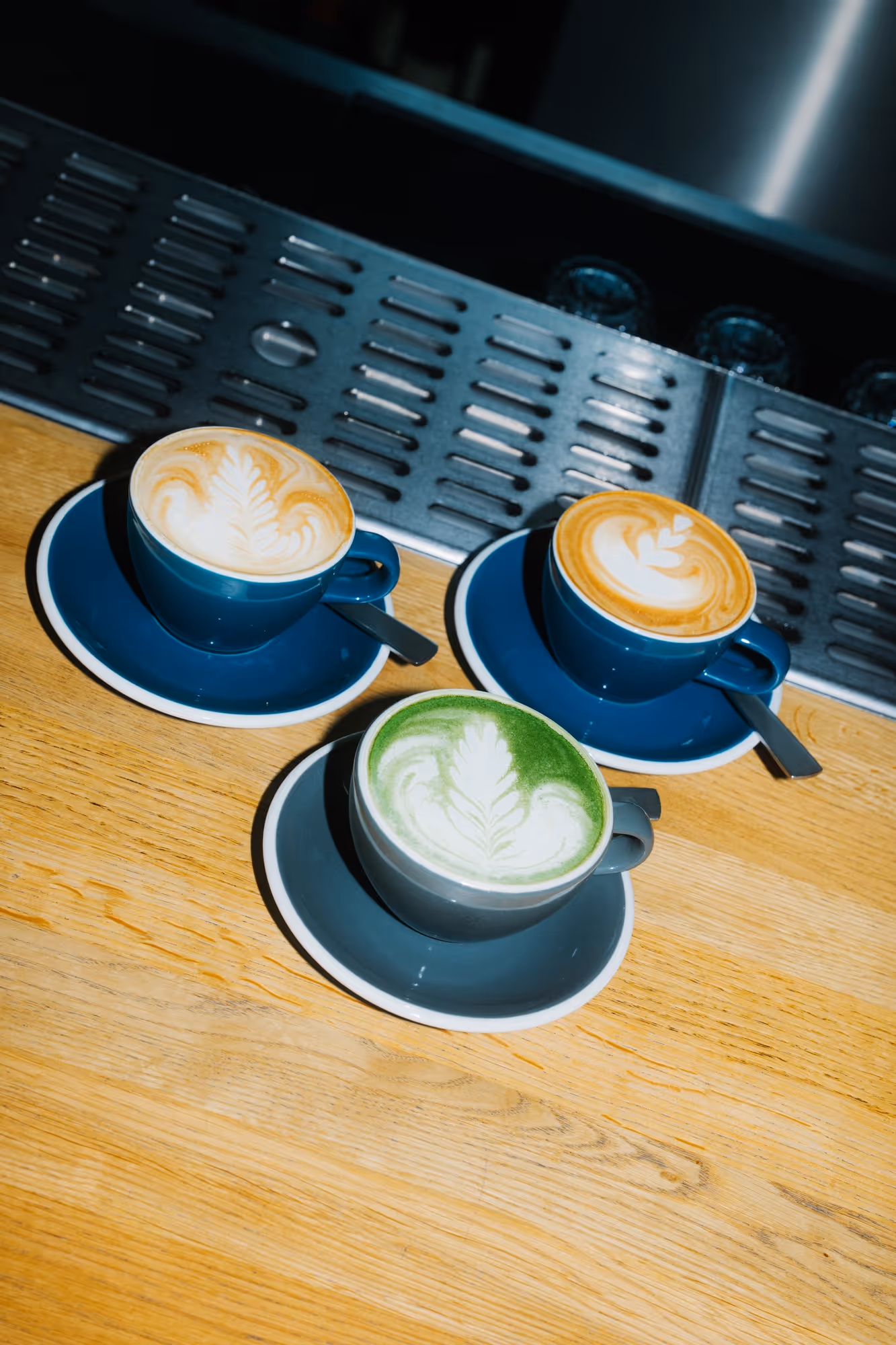 a group of coffee cups on saucers
