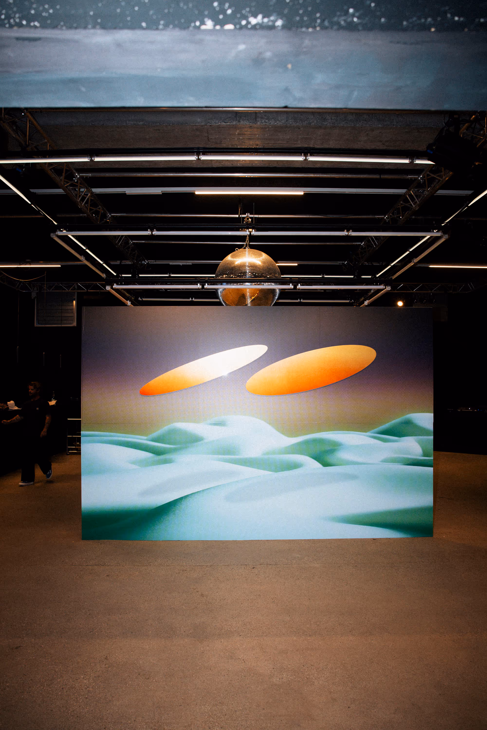a large picture of two orange circles on a wall