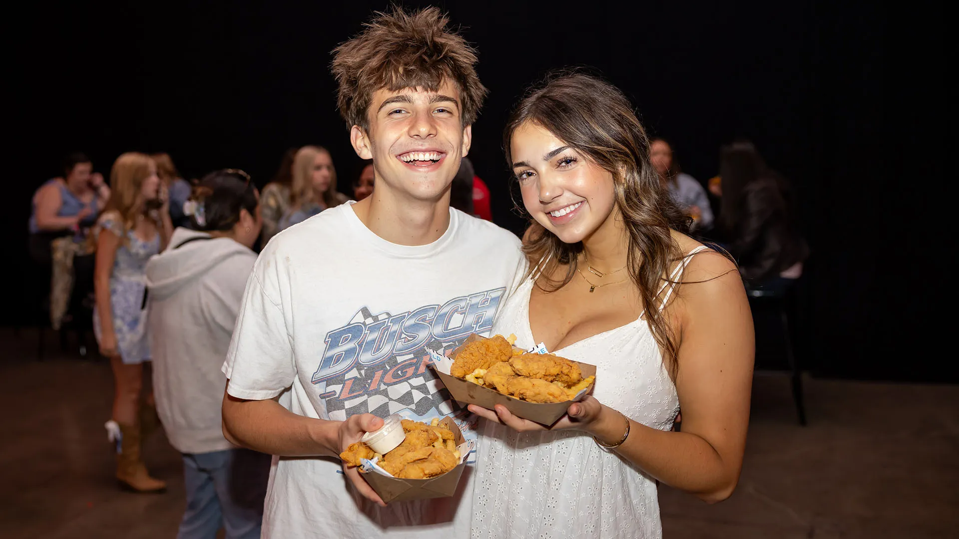 Two fans enjoying concessions at the WAMU Theater