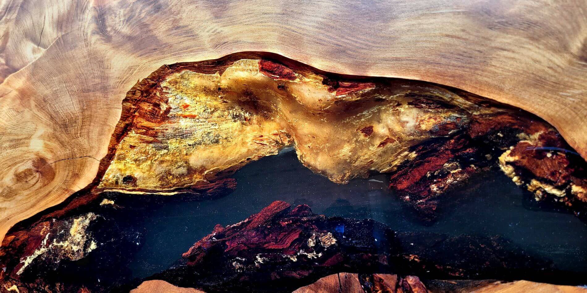 Unique wooden table with original golden amber in epoxy resin as a globally exceptional design table