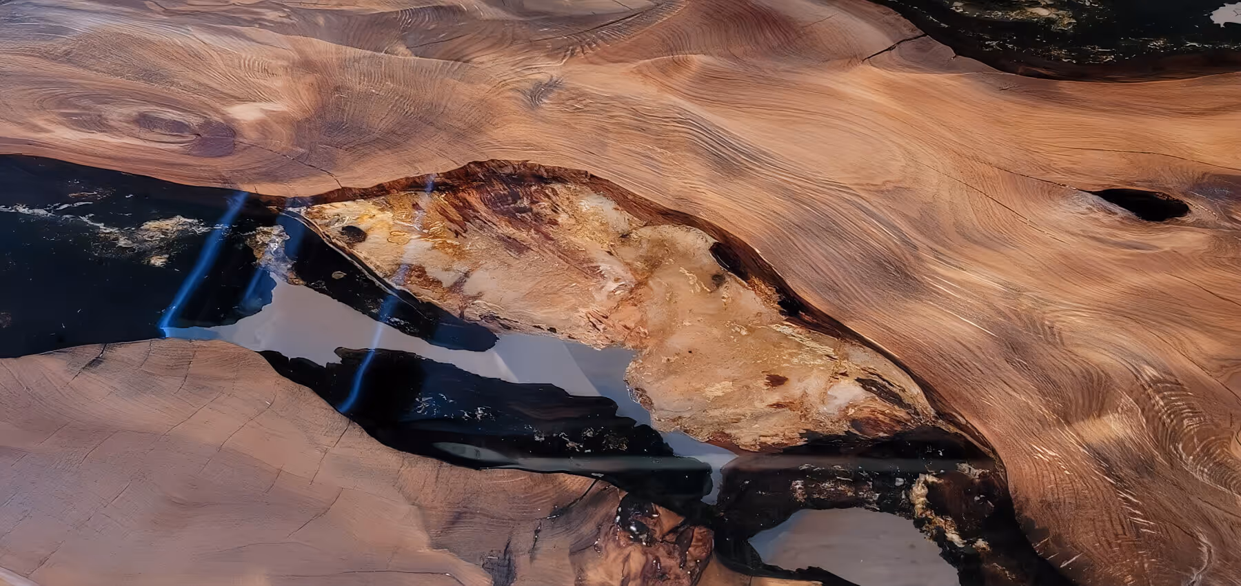 Unique wooden table with original golden amber in epoxy resin as a globally exceptional design table