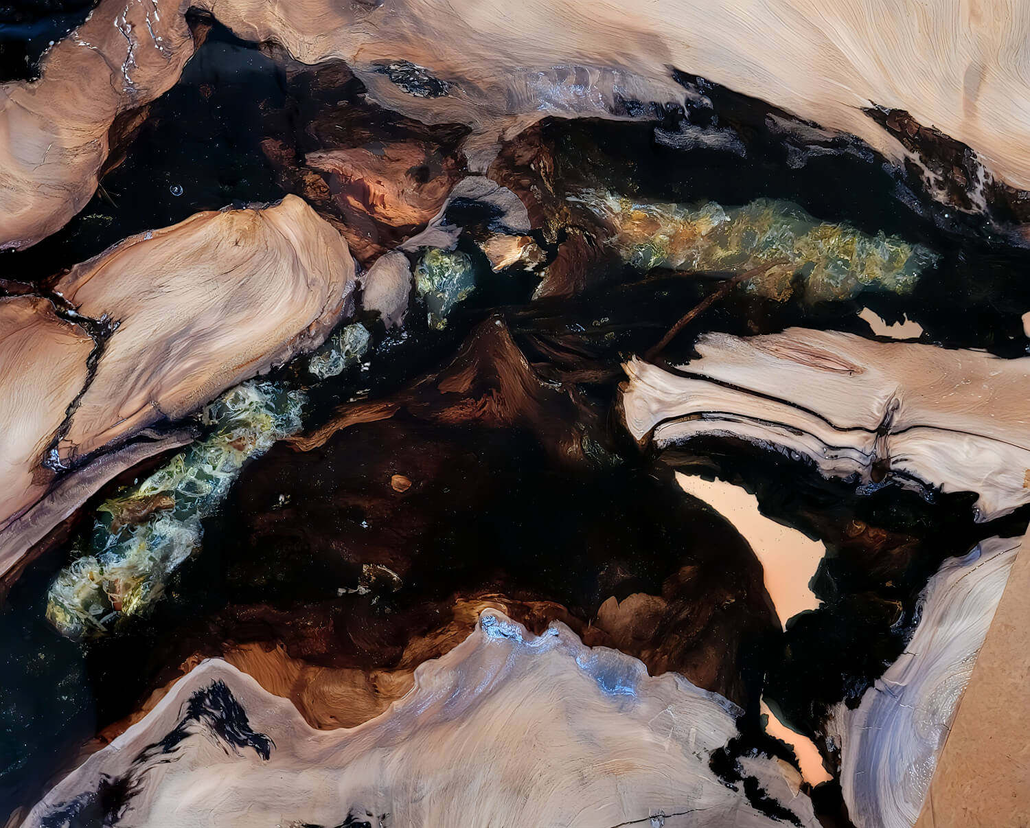 Collectible design furniture, artwork, and exceptional craftsmanship in the form of a tabletop made from kauri wood and amber